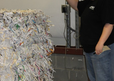 Preparing a bale of shredded documents for transport to a recycler